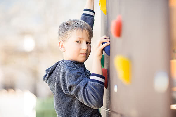Child playing in the playground in the family hotel Sonnen Resort in South Tyrol
