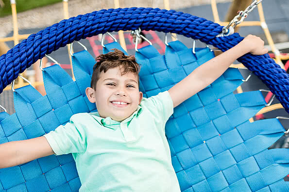 Child on the trampoline in the family hotel Sonnen Resort Naturns